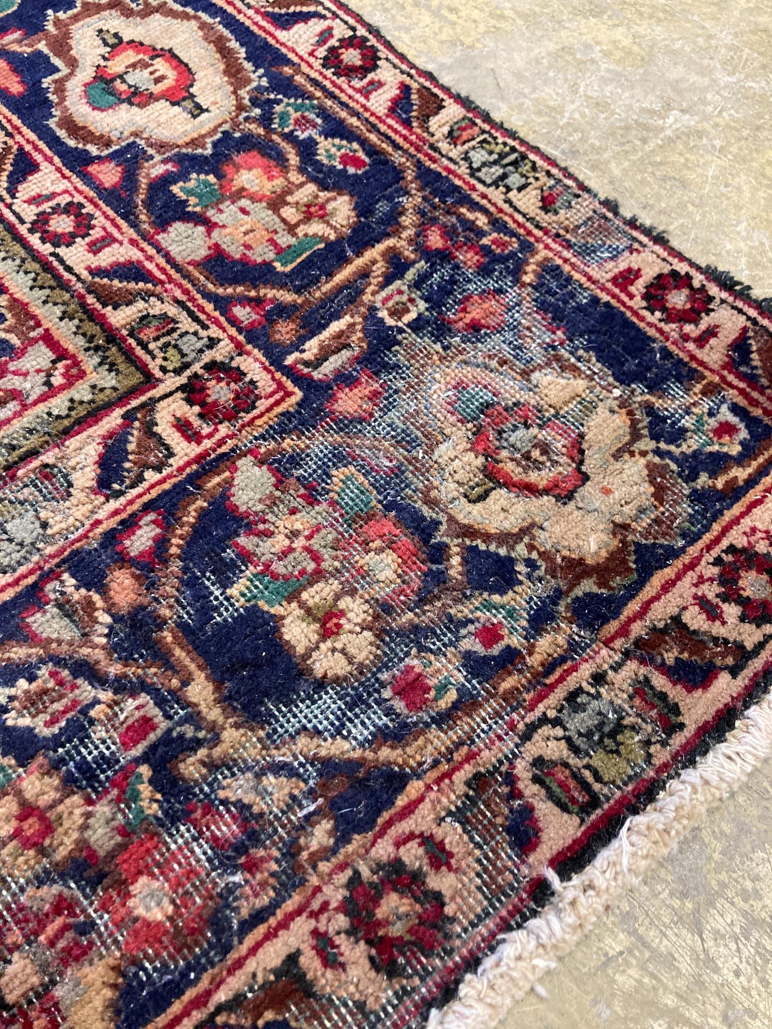 A North West Persian design blue ground carpet, 284 x 196cm